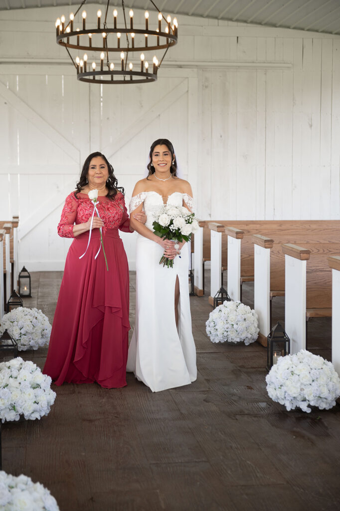 Bride walking down the aisle with soft sunlight