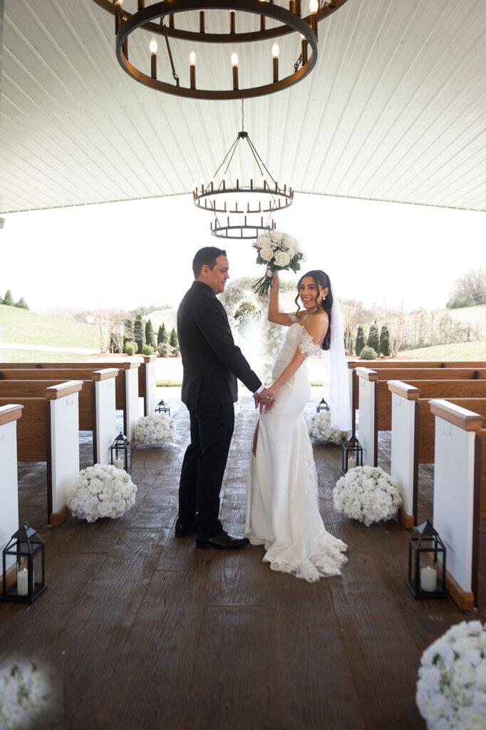 Couple walking up the aisle, just married