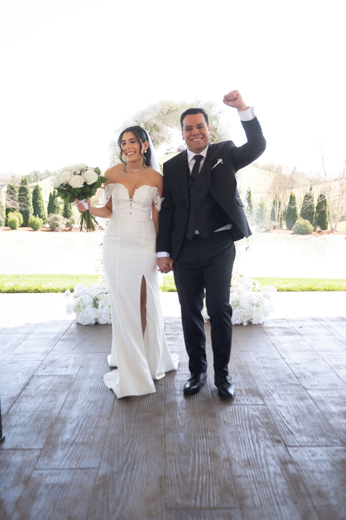 Groom wiping away a happy tear