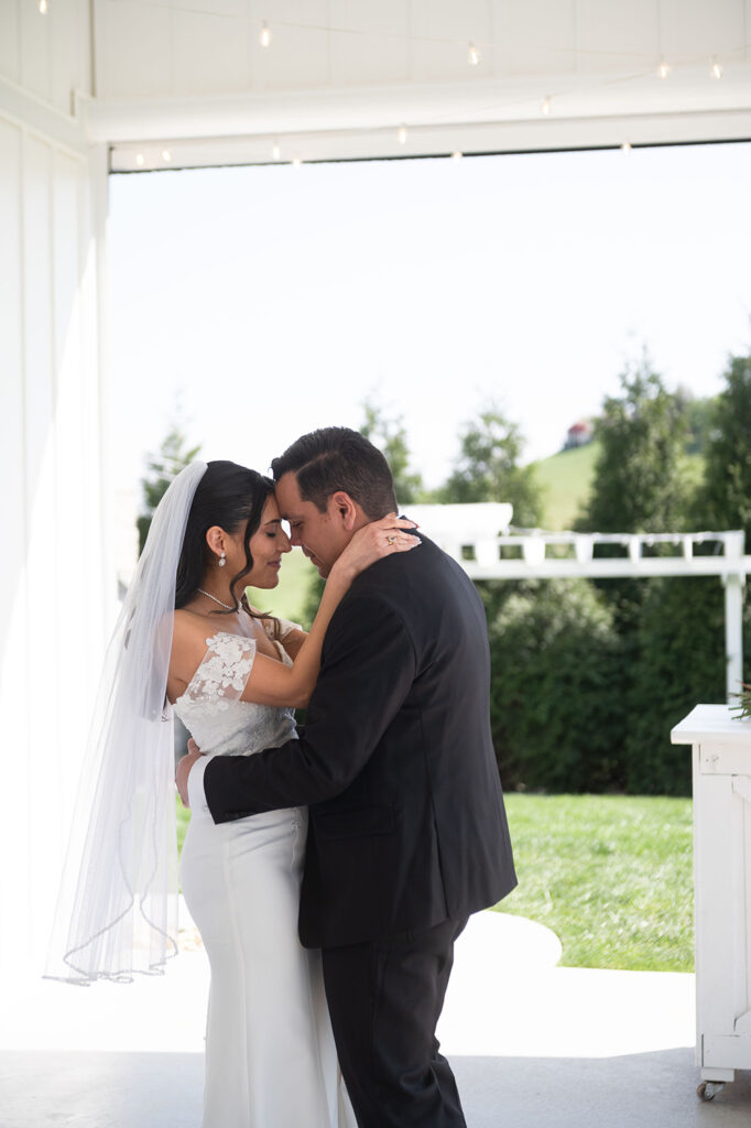 Intimate first dance under string lights