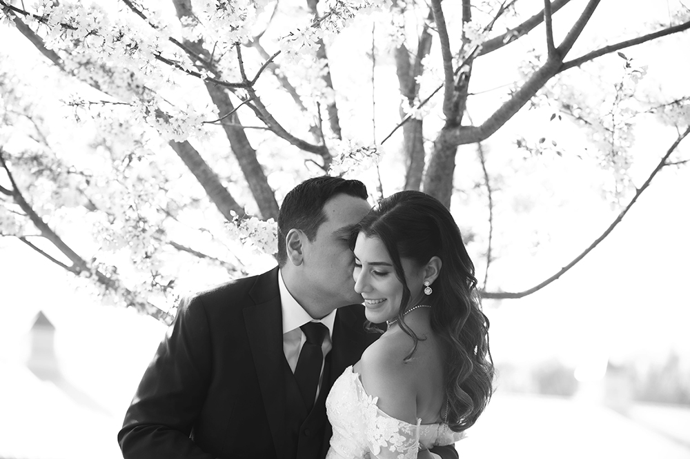 Black and white photo of their kiss